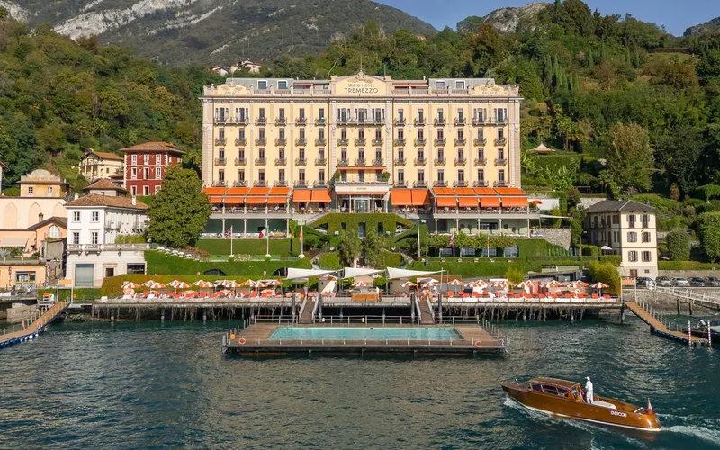 The facade of Grand Hotel Tremezzo seen from the water, a Lake Como hotel in Tremezzina