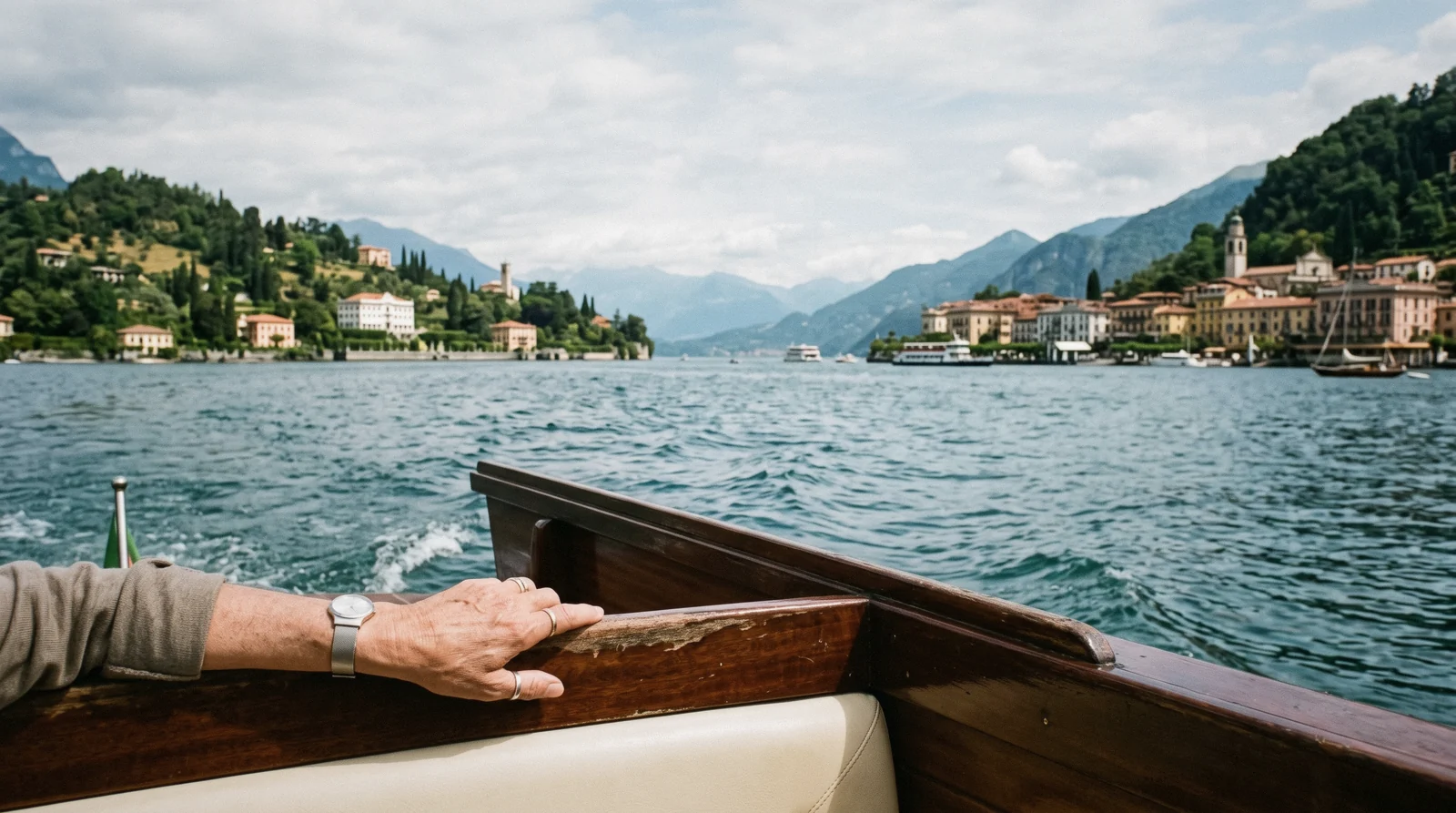 A wooden boat crossing the central lake between Bellagio and Tremezzo, Lake Como in two days