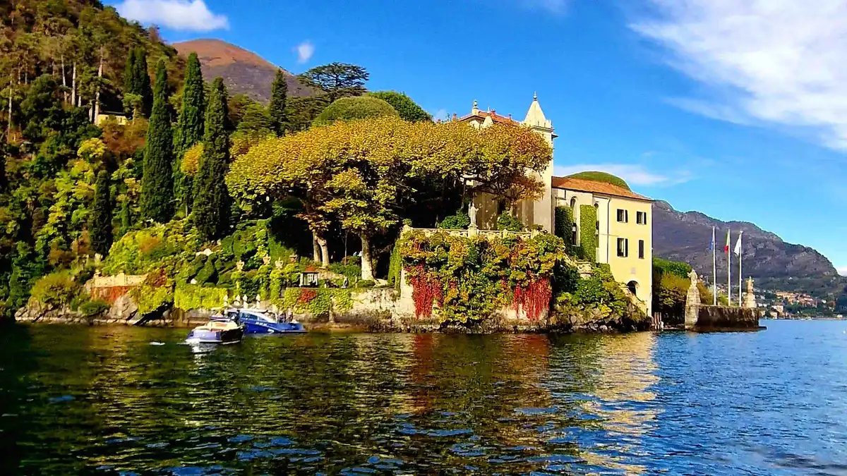 Shared speedboat passing the Orrido di Nesso waterfall on Lake Como
