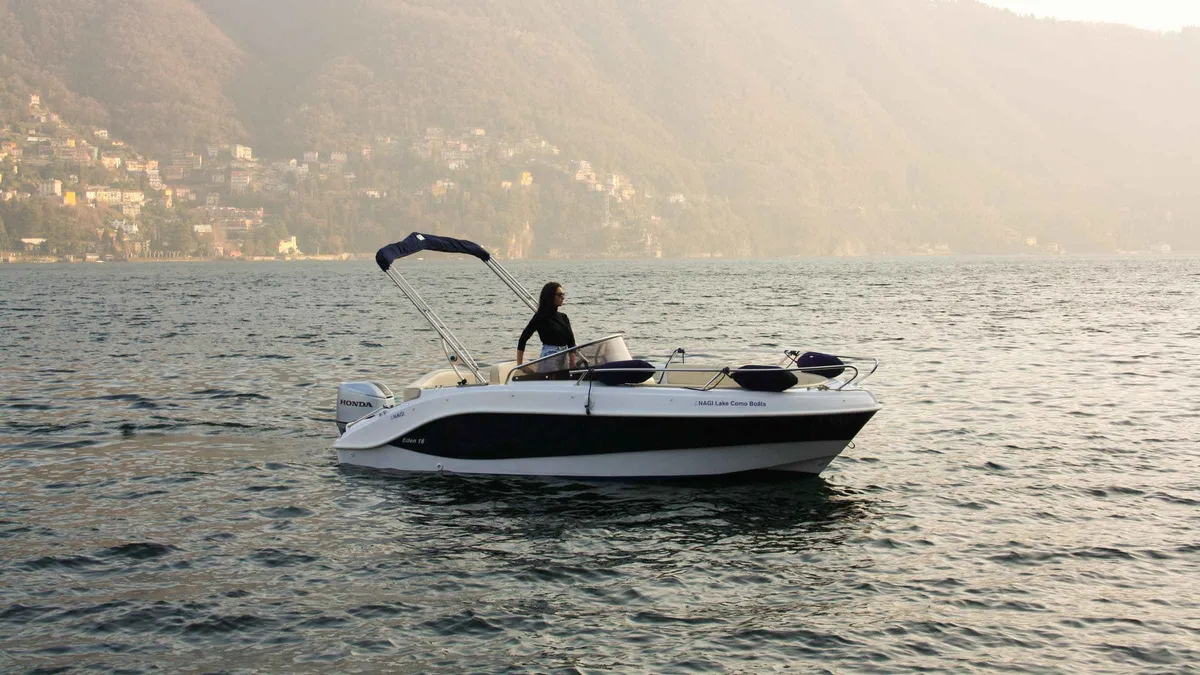 Private rental boat setting out from Laglio on the western shore of Lake Como