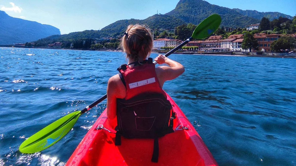 Sit-on-top kayaks on the shore at Valmadrera on the Lecco arm of Lake Como