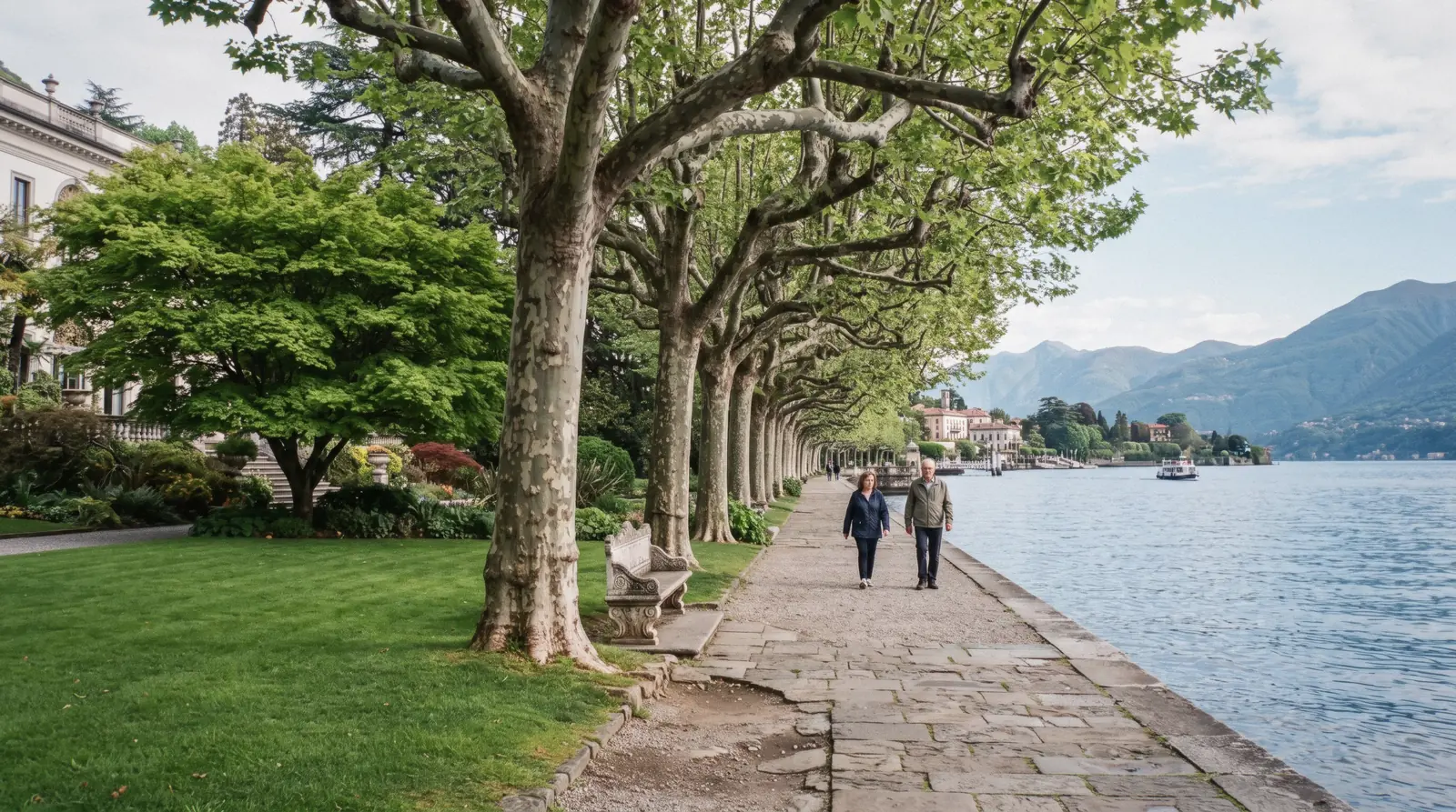 The neoclassical facade and lakeside lawns of the gardens of Villa Melzi at Bellagio, Lake Como